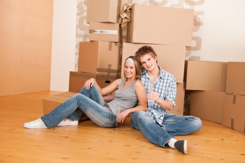Man with van loading items for a local move in Hatchend