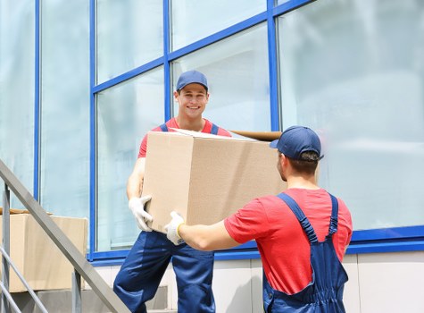Man with van loading boxes for a local move in Hatchend