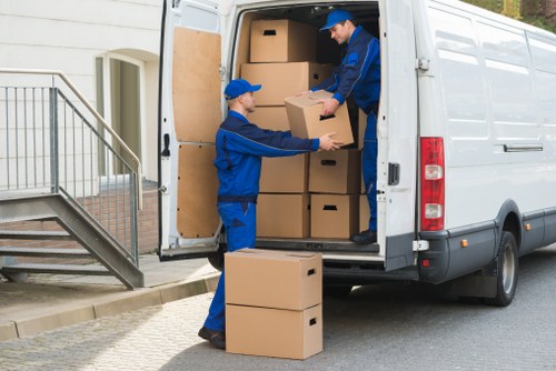 Packed boxes and furniture ready for transport by local movers