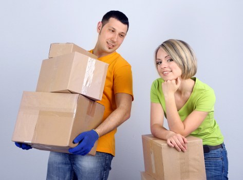 Local removals crew loading boxes and household items in Hatch End