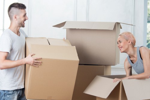 Careful loading of desks and files for an office move in Hatch End