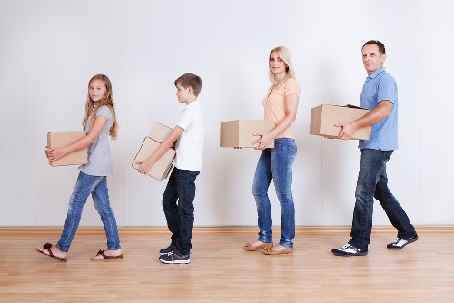 Careful wrapping and labelling of household items during a packing service